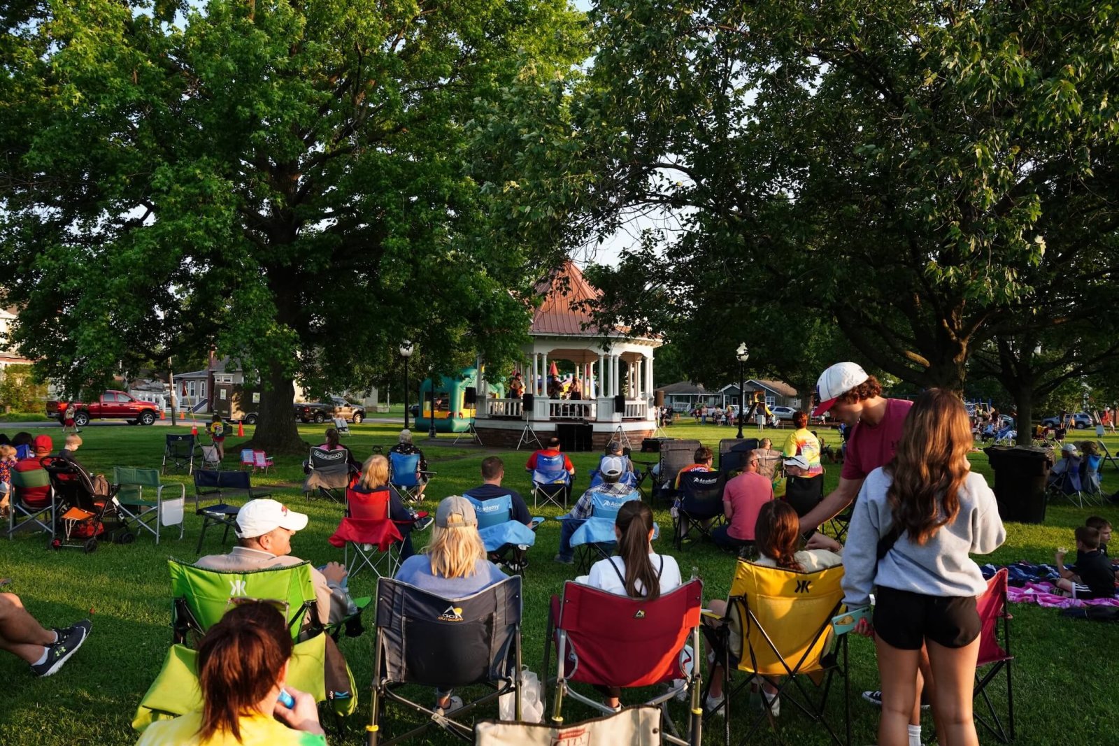 Gazebo in a park full of people
